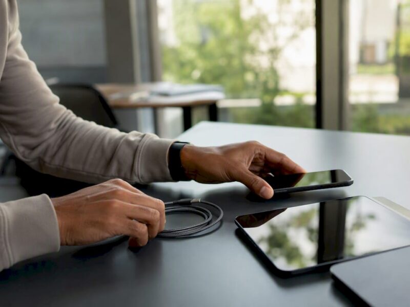 Hands arranging devices for ad campaign setup