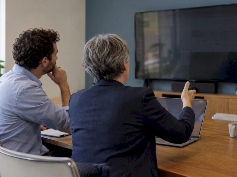 Executives reviewing an advertising performance dashboard